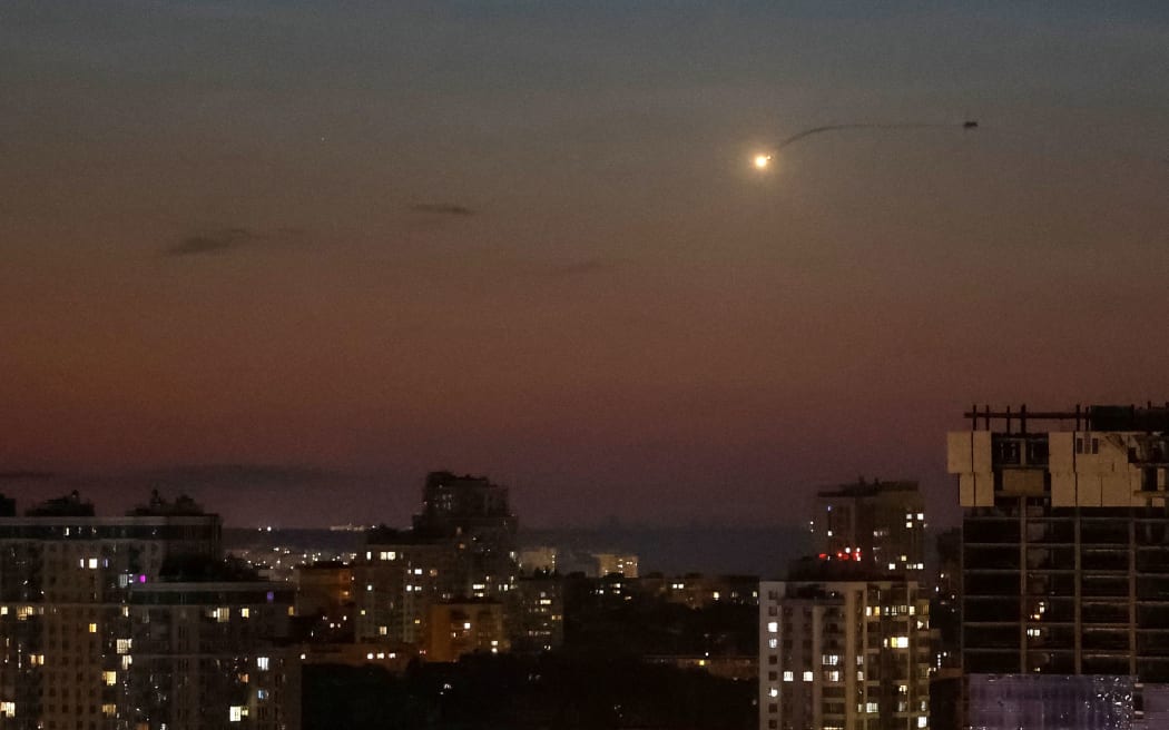 An explosion of a drone is seen in the sky over the city during a Russian drone, amid Russia's attack on Ukraine, in Kyiv, Ukraine 28 June.