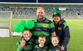 Bayden + Shaye Anderson and their three children at the Porangahau rugby final at McLean Park in Napier