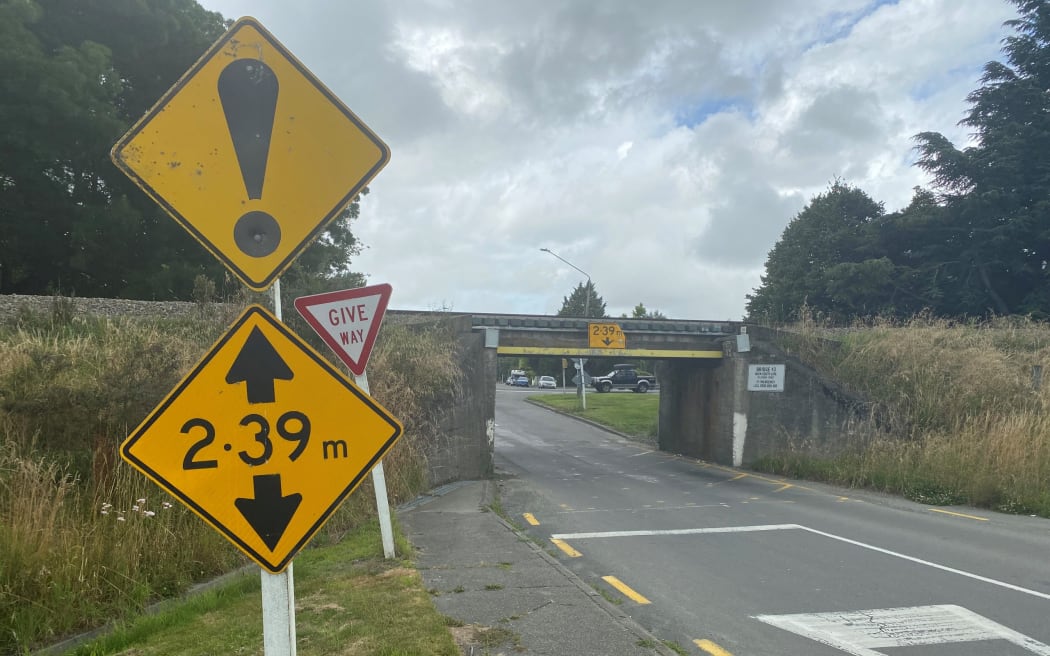 The warning signs for the height restriction at the Tinwald Viaduct are deemed adequate but further safety improvements are being investigated.