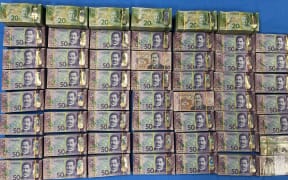 As a part of Operation Elusive, police arrest a man after a vehicle search revealed more than $100,000 in cash, and a significant amount of methamphetamine.