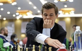 Norway's Magnus Carlsen competes during his Round 10 game against the Moldova's team at the 44th Chess Olympiad 2022, in Mahabalipuram on August 8, 2022. (Photo by Arun SANKAR / AFP)