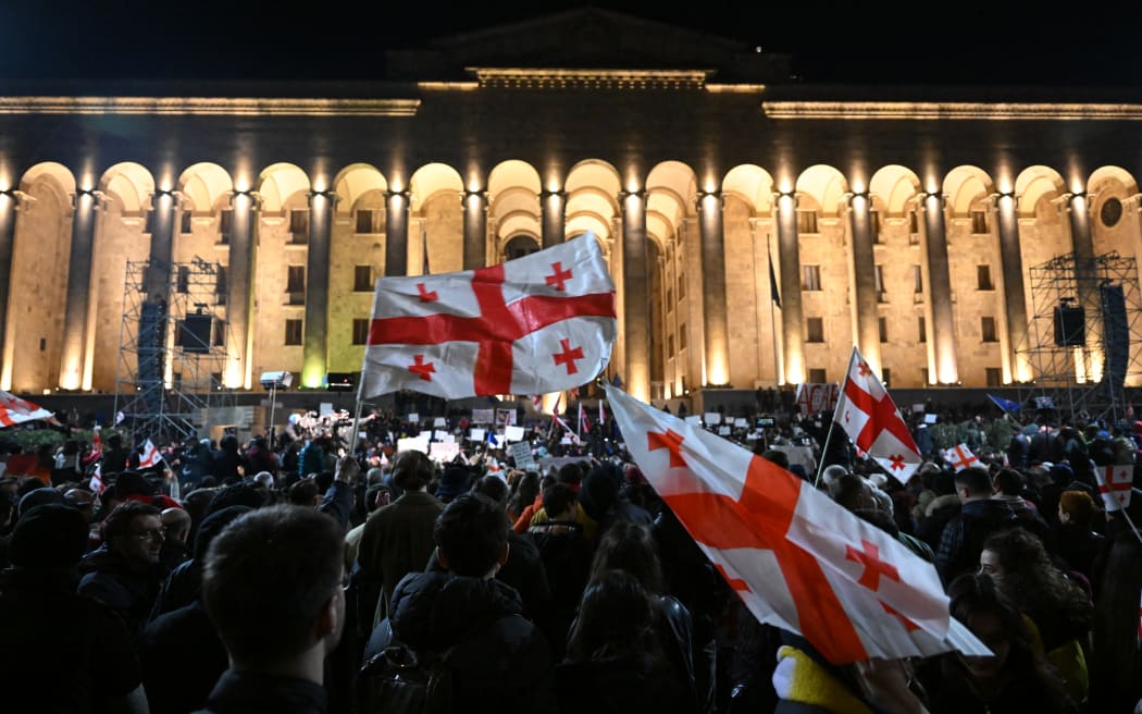 Georgian opposition supporters rally calling for government to follow 'pro-Western' path, outside the parliament in Tbilisi on 9 March, 2023.