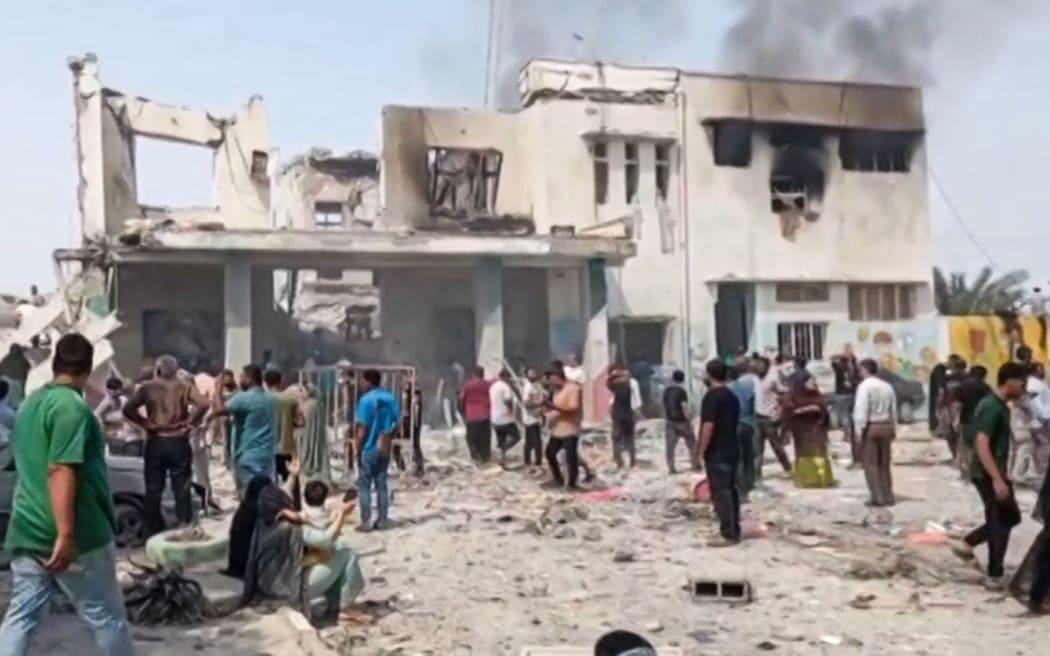 This image grab taken from Iranian state television broadcasted on February 28, 2026, show what it says is the site of deadly US and Israeli strikes that hit a girls' elementary school in Minab, in the southern Iranian province of Hormozgan near the strategic sea route of the Strait of Hormuz. The United States and Israel launched strikes against Iran on February 28, sparking fears of regional war with explosions reported across the Middle East as the Islamic republic retaliated with barrages of missiles. (Photo by IRIB TV / AFP) / RESTRICTED TO EDITORIAL USE - MANDATORY CREDIT "AFP PHOTO / IRIB / HANDOUT" - NO MARKETING NO ADVERTISING CAMPAIGNS - DISTRIBUTED AS A SERVICE TO CLIENTS / “The erroneous mention[s] appearing in the metadata of this photo been modified in AFP systems in the following manner: [BYLINE: -]. Please immediately remove the erroneous mention[s] from all your online services and delete it (them) from your servers. If you have been authorized by AFP to distribute it (them) to third...