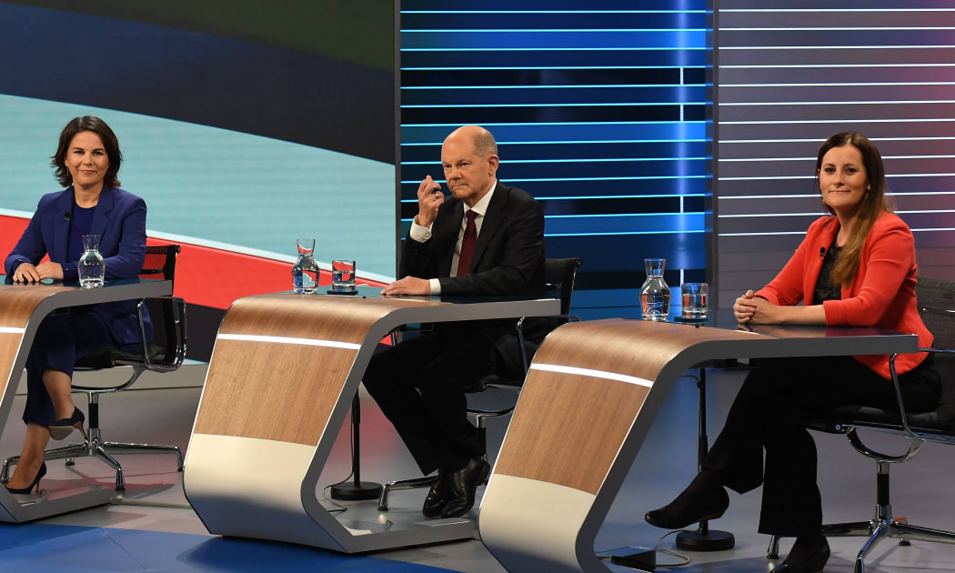 Tco-leader of Germany's Green Party (Die Gruenen) Annalena Baerbock, German Finance Minister and Vice-Chancellor Olaf Scholz, and co-leader of Die Linke Janine Wissler on September 23, 2021 in Berlin,