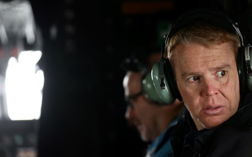 Chris Hipkins boards a helicopter for a flight from Napier to Wairoa after the devastation of cyclone Gabrielle. The flight had to be abandoned due to low cloud.