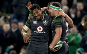 Ireland's Bundee Aki celebrates with try scorer Rob Herring.