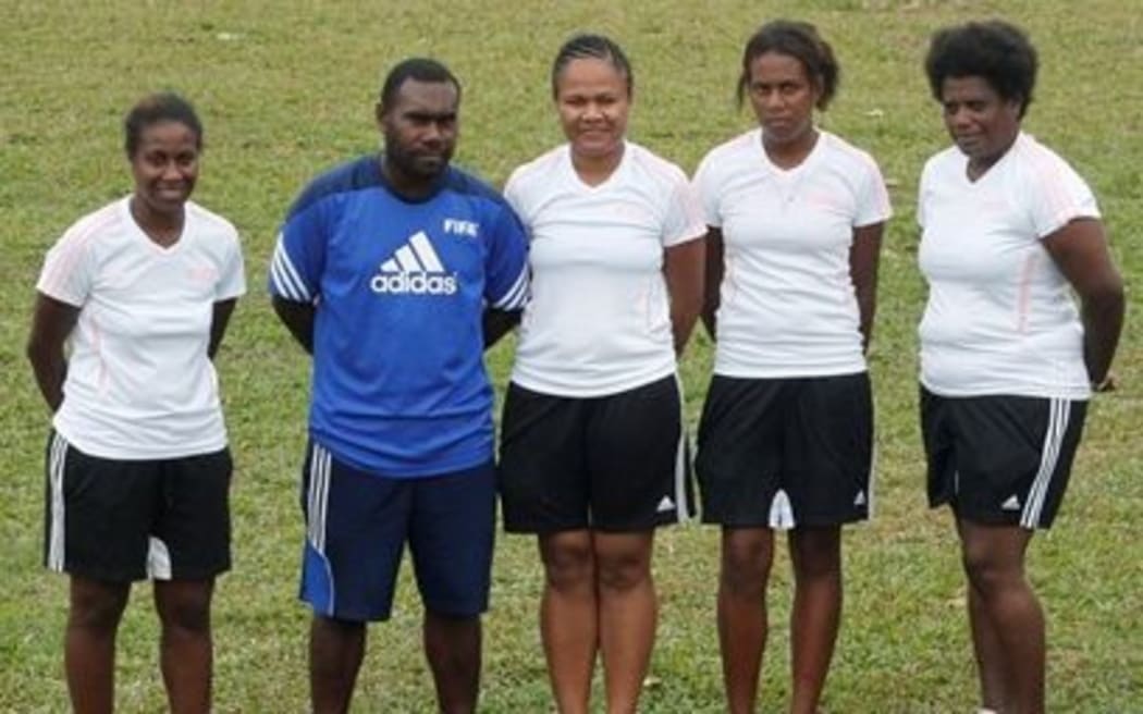 Vanuatu Women's Football Development Officer, Joel Rarua, with members of his committee