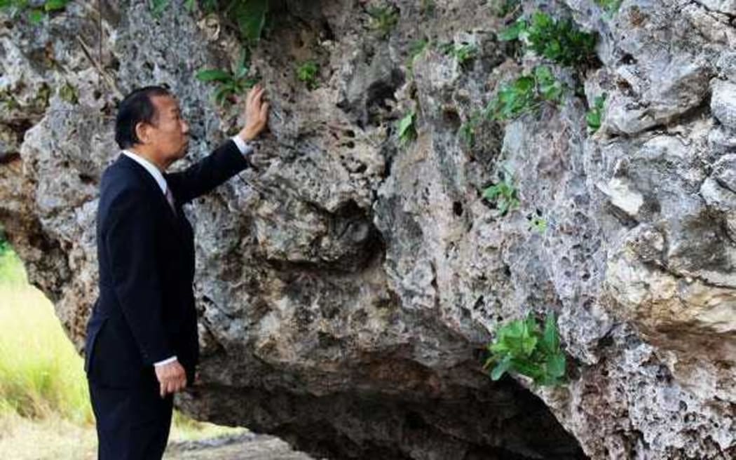 Toshihiro Nikai inspects Maui's Stone.