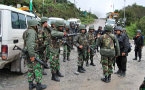 Indonesian soldiers and policemen deployed on the road to the Freeport mine in Papua province.