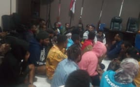 The protesters were arrested and held in the Surabaya police station.