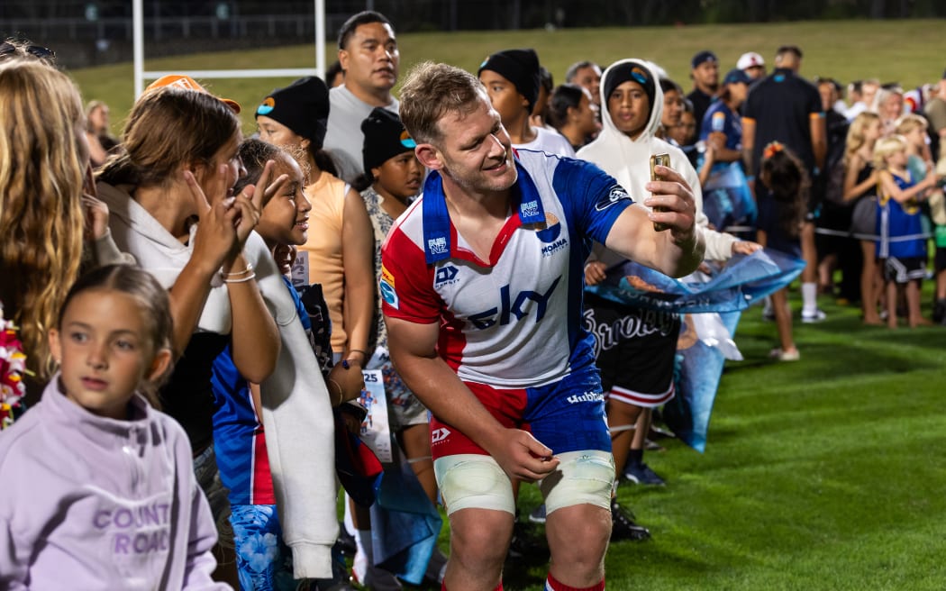 Moana Pasifika lock Tom Savage with fans after the Super Rugby Paciﬁc - Moana Pasiﬁka v Highlanders at North Harbour Stadium.