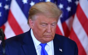 US President Donald Trump looks on after speaking during election night in the East Room of the White House in Washington, DC, early on November 4, 2020.