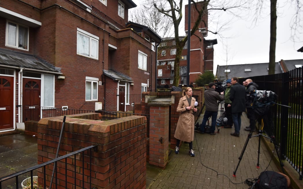 Journalists gather outside a residential address in London where Kuwaiti-born Mohammed Emwazi, identified by experts and the media as "Jihadi John", is once believed to have lived.