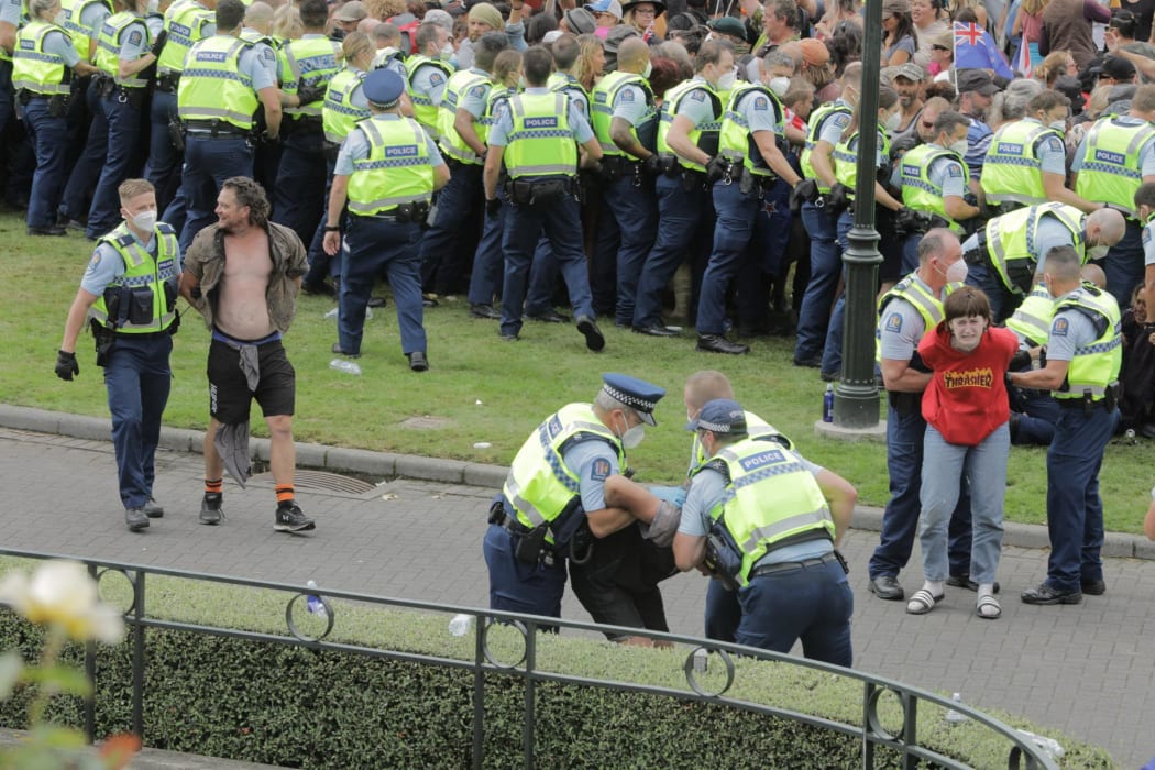 Police make multiple arrests in an effort to remove protesters occupying Parliament's precinct for a third day.