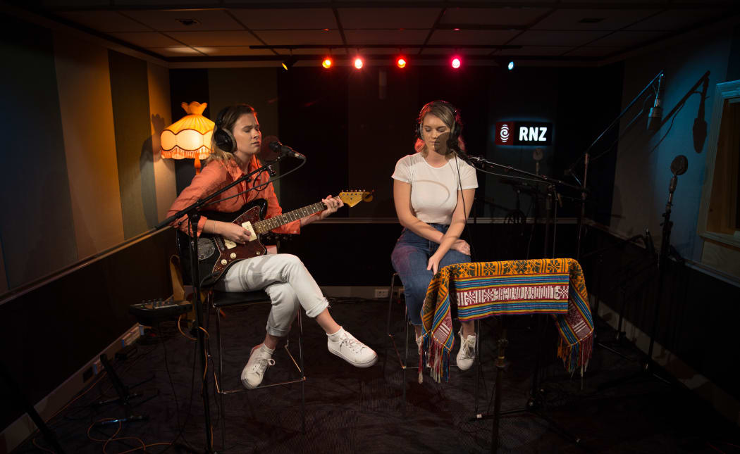 Georgia Nott and her sister Nika (Olivia) in the RNZ Auckland Studio