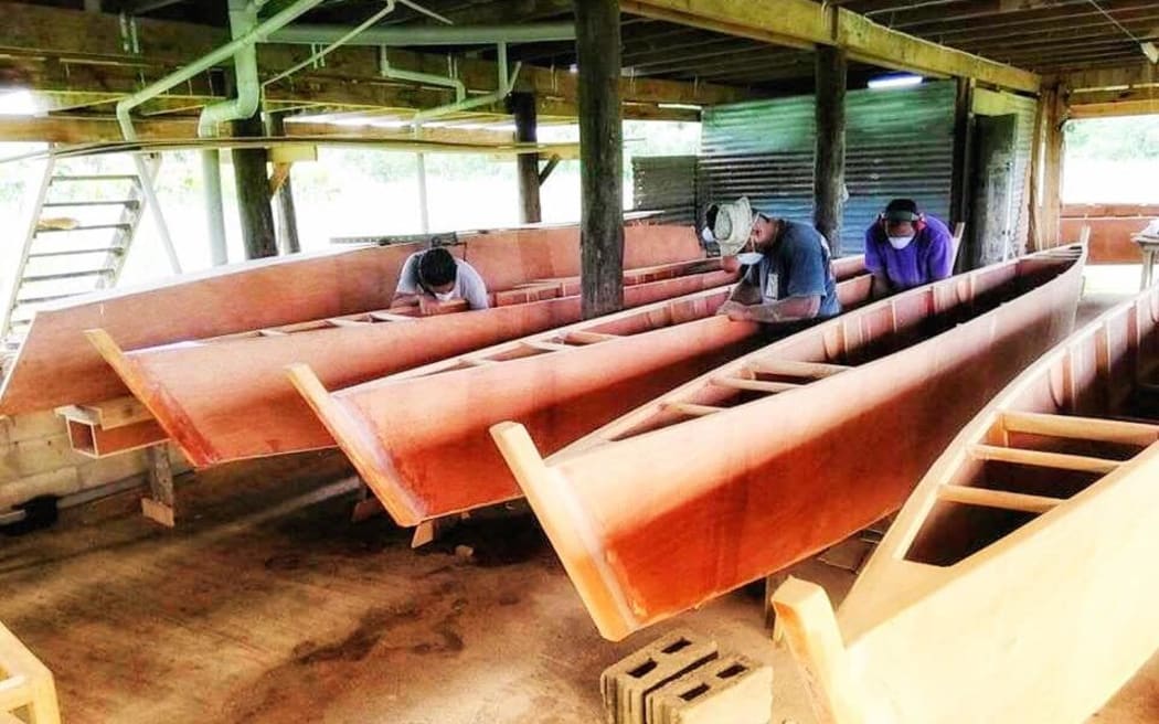 At the construction site finishing off the first five canoes, built by volunteers with the Uto ni Yalo Trust