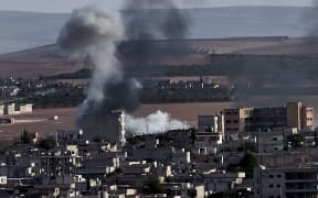 Smoke rises after an air strike on Kobane, which has seen Islamic State fighters' control of the Syrian town severely dented.
