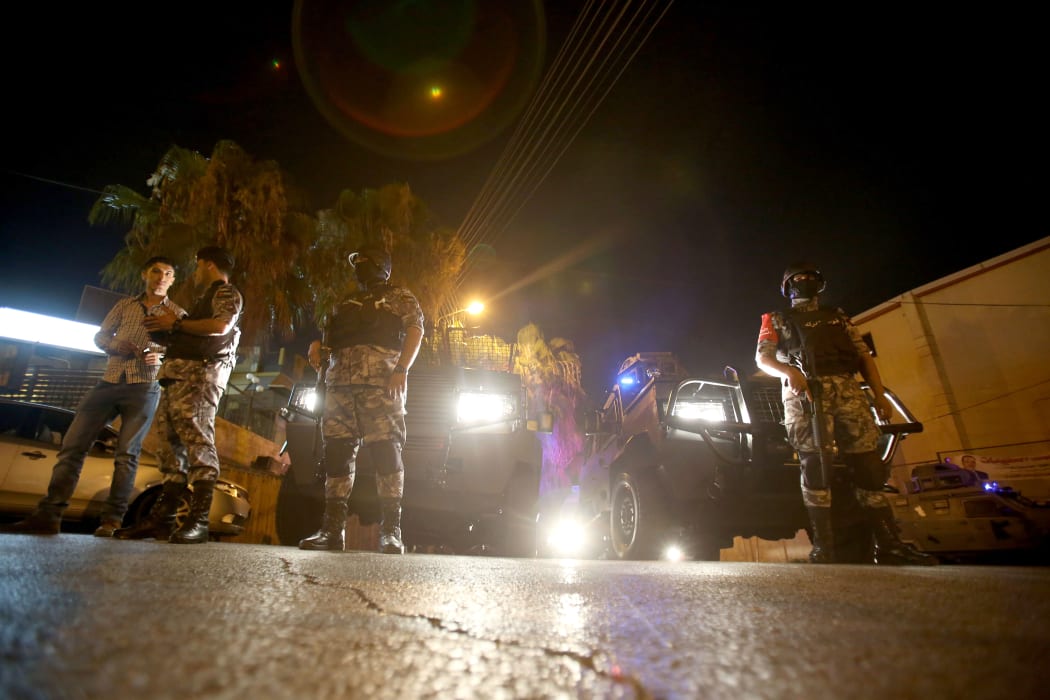 Security forces stand guard outside the Israeli embassy in the residential Rabiyeh neighbourhood of the Jordanian capital Amman.