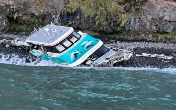 A new photo of the Black Cat Cruises boat shows that its wreck is now on shore.