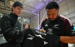 All Blacks hooker Asafo Aumua signs autographs at Parakiore Recreation and Sports Centre, Christchurch.