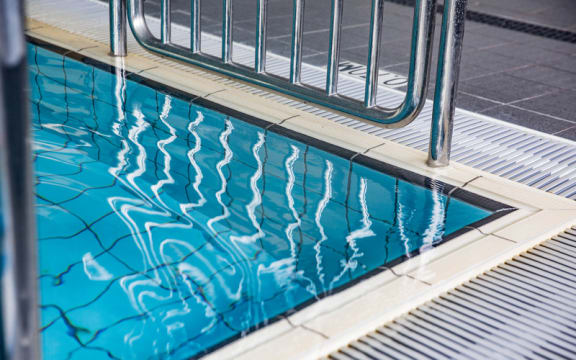 A swimming pool with gated entry.