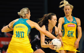 Bailey Mes of the Silver Ferns is tackled by Clare McMeniman of the Diamonds and Laura Geitz of the Diamonds during the Constellation Cup Netball match, Silver Ferns v Australia, in Christchurch, on the 20th October 2015.