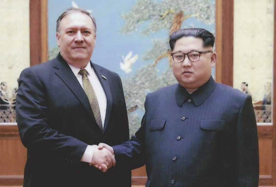 North Korean leader Kim Jong-Un shakes hands with US Secretary of State Mike Pompeo.
