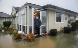 Merv and Hazel Roper at their Oamaru house after torrential rain caused surface flooding.