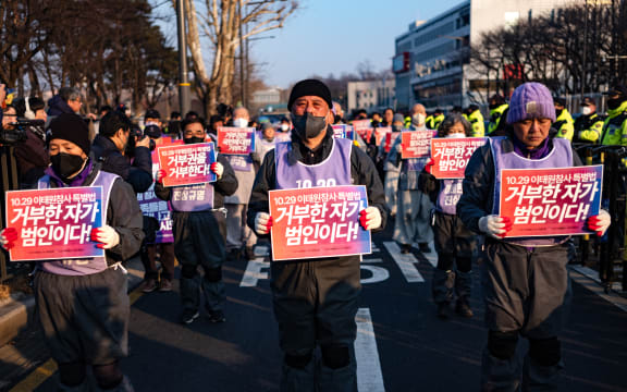 Family members and religious figures conduct a full-body prostration protest in front of Itaewon Station in Yongsan-gu, Seoul, facing the direction of the Presidential Office, demanding the promulgation of the Itaewon Disaster Special Law on 29 January, 2024 in Seoul, South Korea.