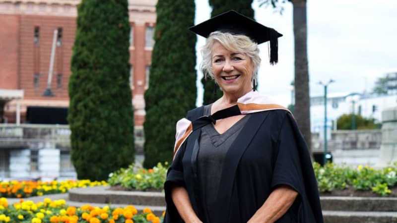 New Zealand food writer Julie Biuso wearing her university graduation cap and gown.
