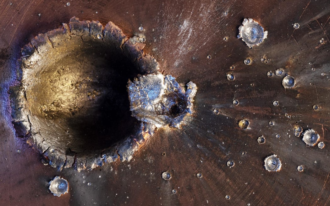 This hypervelocity impact test hangs like a piece of art in the home of Donald Kessler. In the 1970s, Kessler and colleague Burt Cour-Palais made a pioneering study into the build-up of space debris in Earth's orbit.