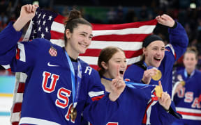 USA Womens Hockey Celebration
Caption:	From left to right, Megan Keller, Aerin Frankel and Hayley Scamurra celebrate after the medal ceremony following the Women's Gold Medal match between the United States and Canada on February 19, in Milan, Italy.
Mandatory Credit:	Andreas Rentz/Getty Images via CNN Newsource