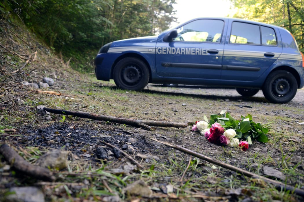 A bouquet of roses left at the scene three days after the bodies of Saad al-Hilli, Iqbal al-Hilli, Suhaila al-Allaf and a French cyclist were found, shot dead, in Chevaline in south-eastern France.