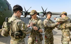 Combat Control Team members of the South Korean Air Force 5th Air Mobility Wing preparing to depart for Sudan at an undisclosed location in South Korea on 21 April, 2023. - Seoul said on April 21, it would send a military aircraft and soldiers to evacuate South Korean nationals stranded in Sudan.