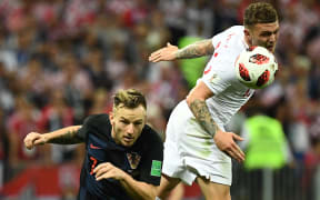 Croatia's midfielder Ivan Rakitic (L) vies for the ball with England's defender Kieran Trippier during the Russia 2018 World Cup semi-final football match between Croatia and England at the Luzhniki Stadium in Moscow on July 11, 2018.
