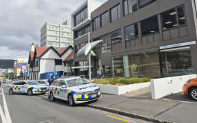 Armed police on Ghuznee Street in the central Wellington suburb of Te Aro.