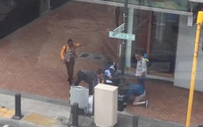 Passersby helped subdue the man until more police could arrive.