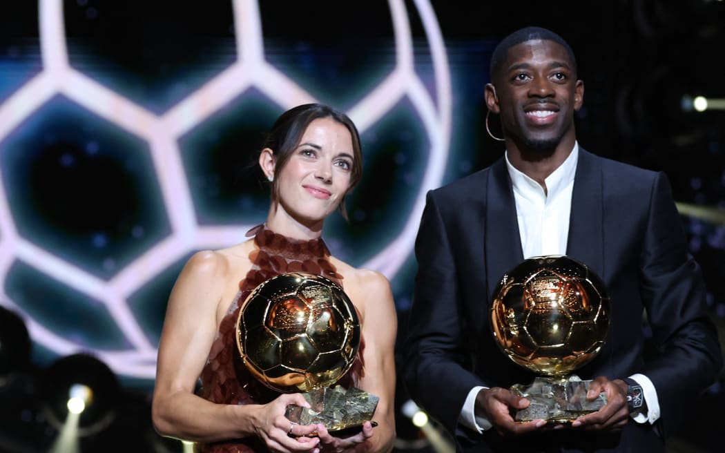 Paris Saint-Germain's French forward Ousmane Dembele and Barcelona's Spanish midfielder Aitana Bonmati pose after receiving the Ballon d'Or awards, 2025.