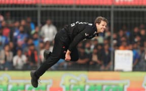 Lockie Ferguson of New Zealand bowling in India, 2023.