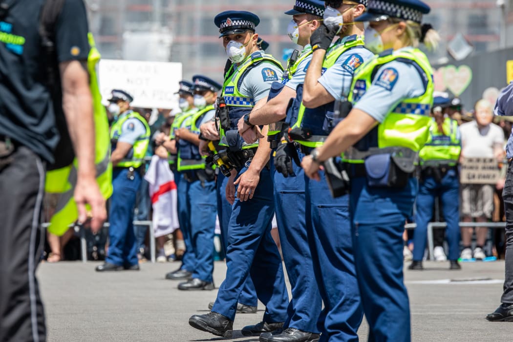 As the protest winds down a group of Police officers line up in front of Parliament.