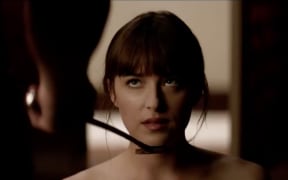 A scene from the movie adaptation of 50 Shades of Grey, a smut novel that depicts violence and rape scenes.