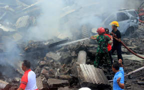 Firefighters at the site of the crash.