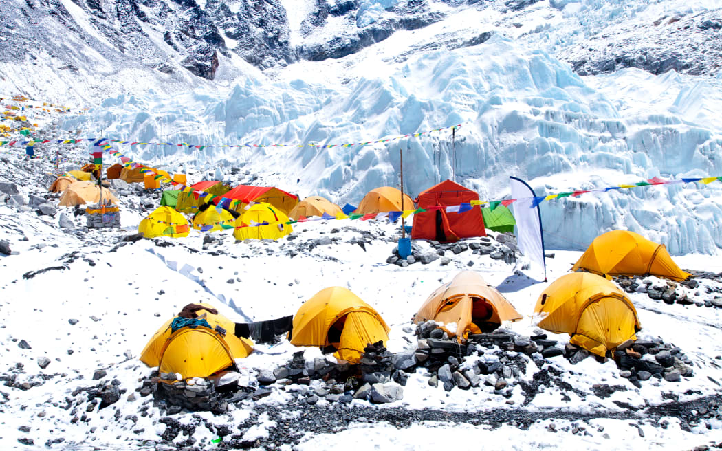 Bright yellow tents in Mount Everest base camp, Khumbu glacier and mountains, sagarmatha national park, trek to Everest base camp - Nepal Himalayas