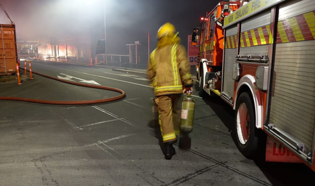 Firefighters enter burning building in Christchurch.