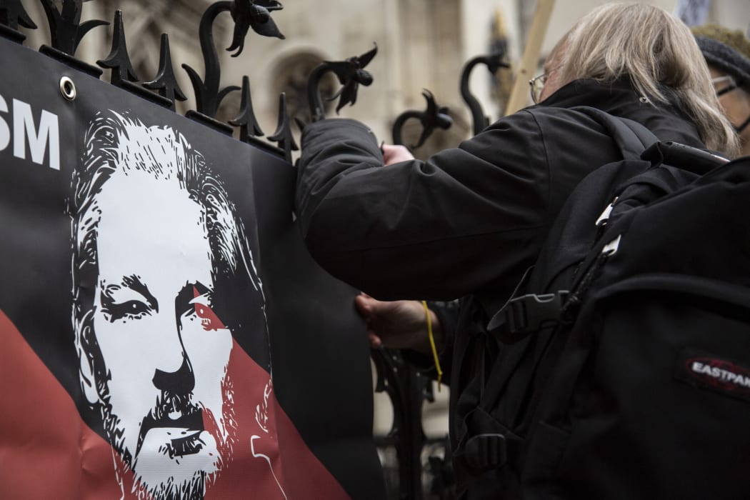 Supporters of Julian Assange stage a demonstration in front of Supreme Court in London on 24 January 2022.