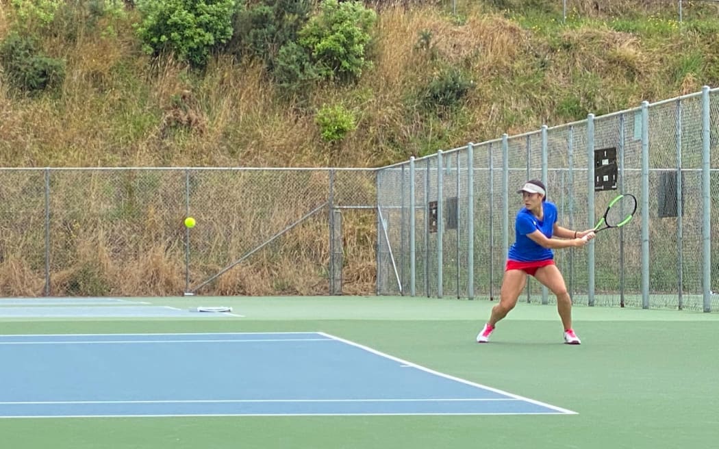 Guam number one Nadine Del Carmen battles the Wellington wind out in court.