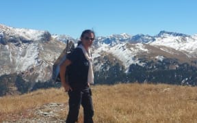 Dr Delwyn Moller carries a corner reflector into the San Juan Mountains, Colorado, for radar calibration during a Nasa airborne snow measurement campaign.