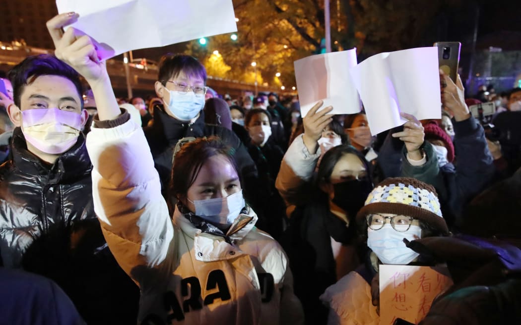 People protest against Zero-Covid in Beijing on Nov. 27, 2022. People held white paper to express their protest against Zero-Covid policy and shouted, “No more PCR tests, we need freedom.”