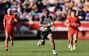 HARRISON, NEW JERSEY - MARCH 14: Terio Veilawa #88 of Fiji carries the ball against Spain during a pool play match in the HSBC SVNS Series New York at Sports Illustrated Stadium on March 14, 2026 in Harrison, New Jersey.   Caean Couto/Getty Images/AFP (Photo by Caean Couto / GETTY IMAGES NORTH AMERICA / Getty Images via AFP)