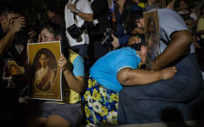 People outside the hospital where King Bhumibol Adulyadej died were stricken with grief when the news of his death was announced.